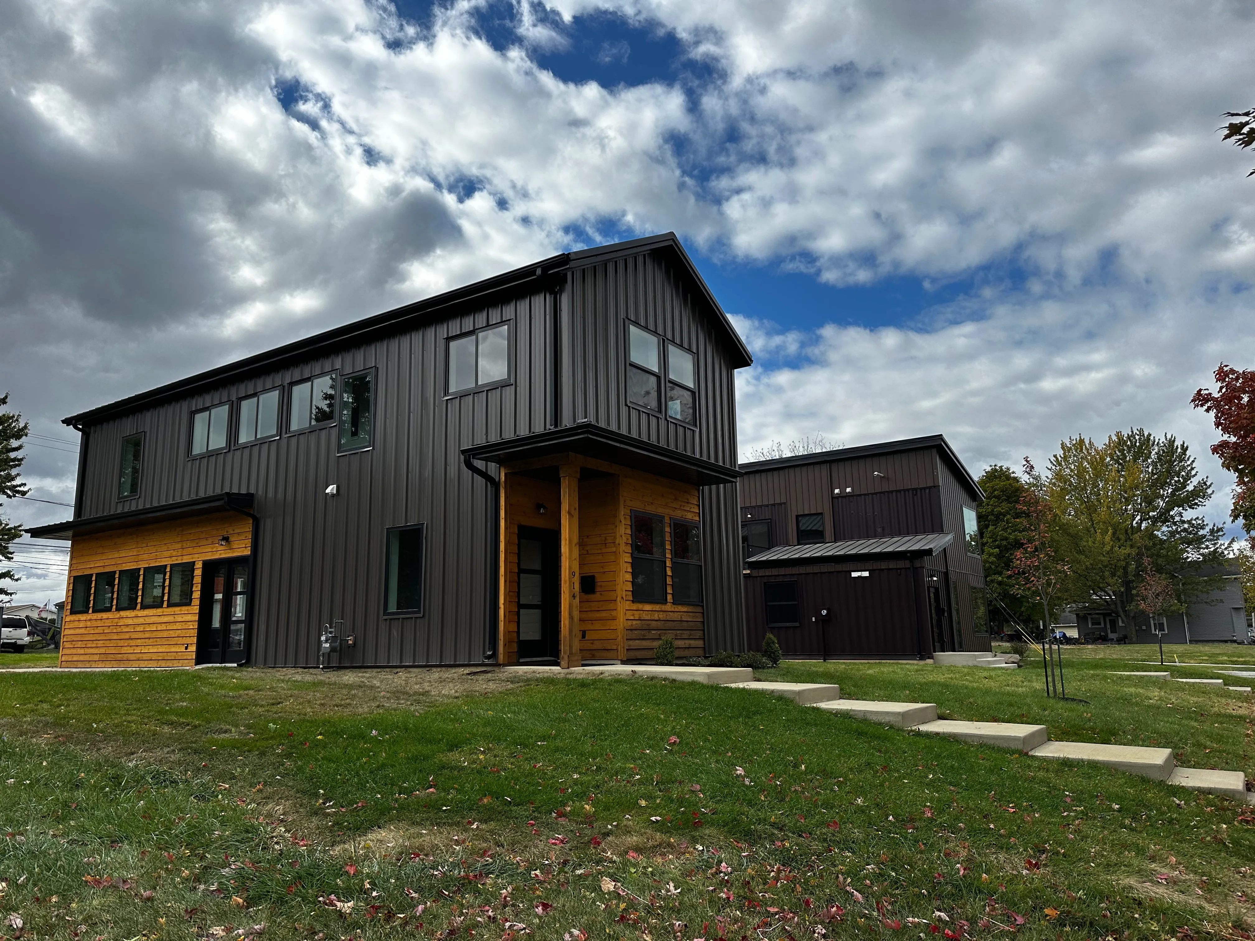 A finsihed black home with wooden accents