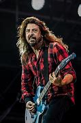 Dave Grohl playing guitar.