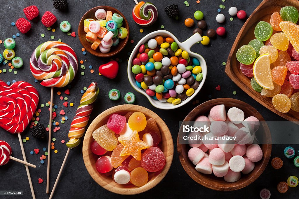 Chocolate bars, gummies, lollipops, caramels, and taffy arranged by type